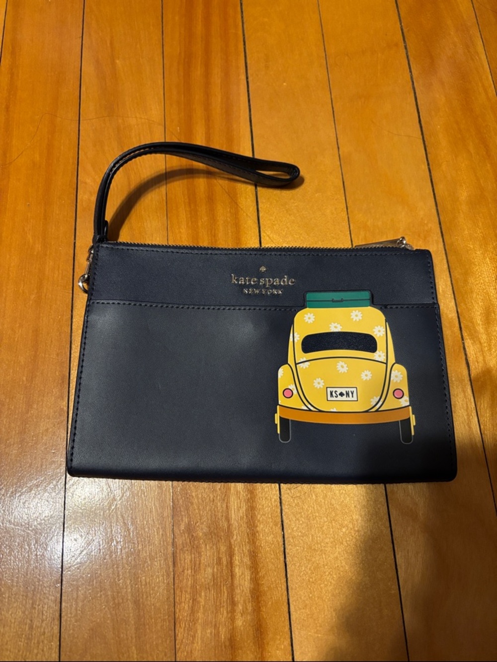 kate spade navy Wristlet with Yellow Car Motif